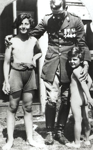 PK as youth with brother and father in uniform